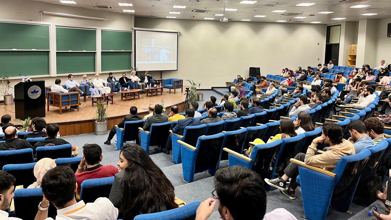 Full lecture hall audience during the panel discussion